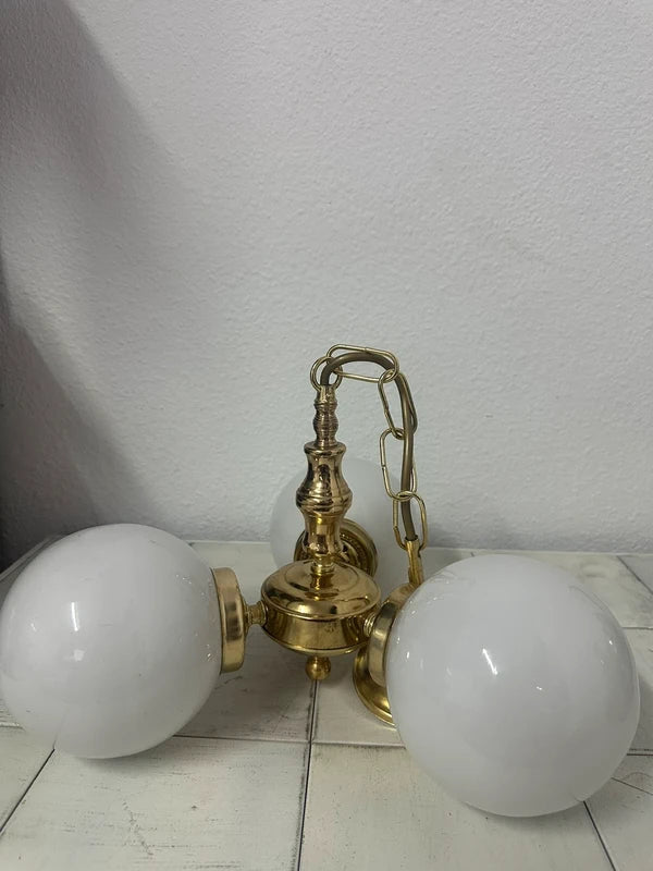 Vintage brass chandelier — brass detail close-up