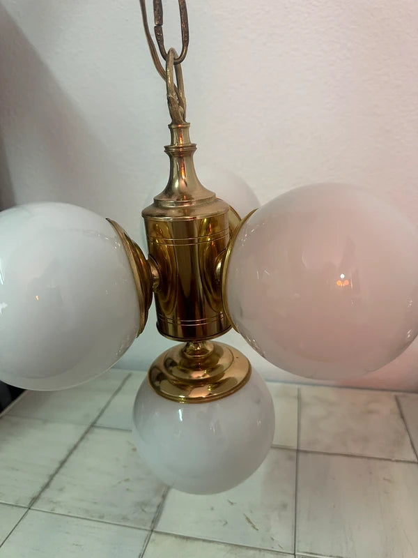 Chandelier detail, brass finish and globe holders