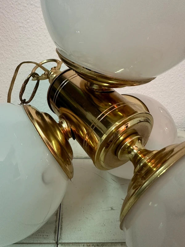 Chandelier hanging from brass chain, bottom view