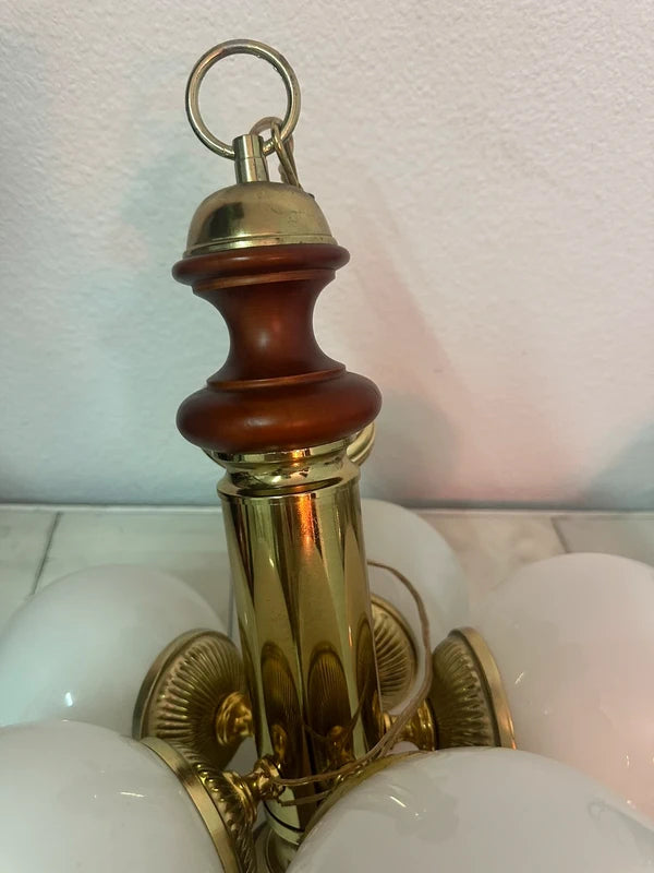 Vintage chandelier — wood and brass column close-up