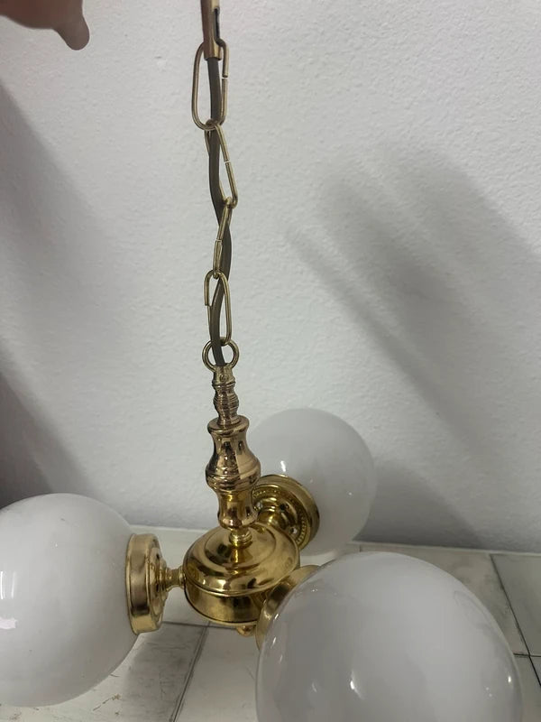 Vintage brass chandelier — disassembled view