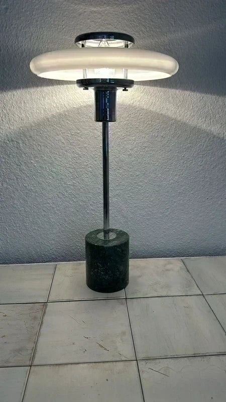 UFO lamp in window, warm yellow light